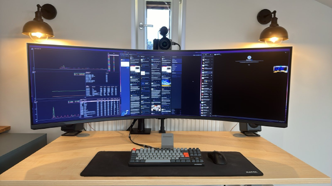 a photograph of my desk including a huge ultra-wide monitor